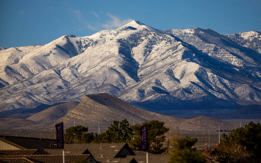 The Spring Mountains, freshly covered in snow, are seen from the Tule Springs Fossil Beds Natio ...