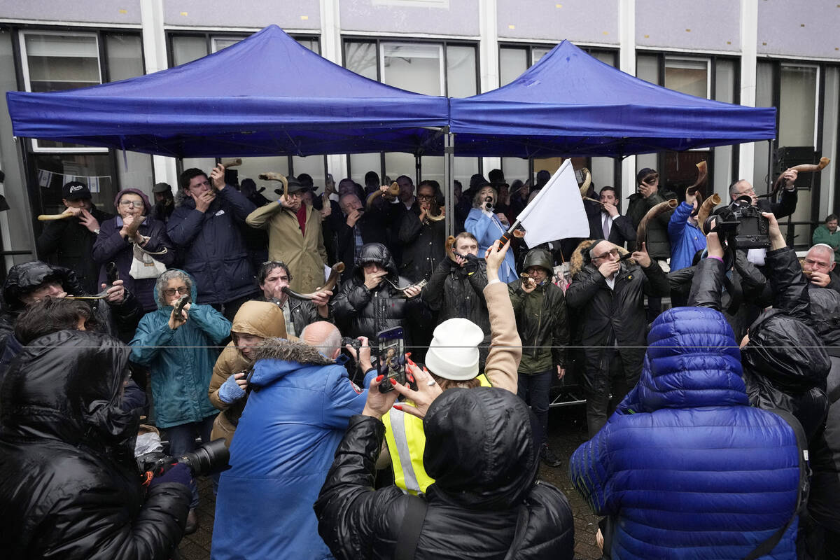 Photographers watch Jewish people and sympathisers blow shofars (ram's horns of spiritual signi ...