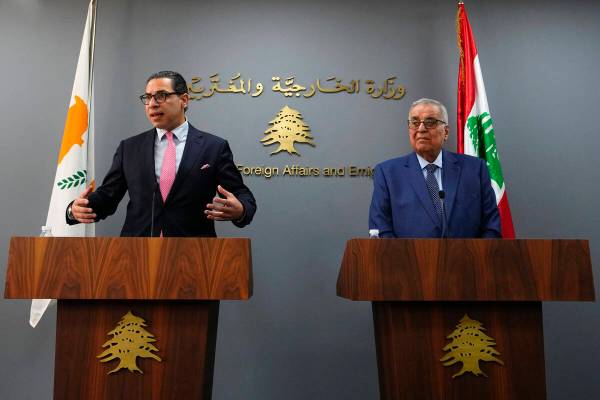 Cyprus Foreign Minister Constantinos Kombos, left, speaks during a news conference with Lebanes ...