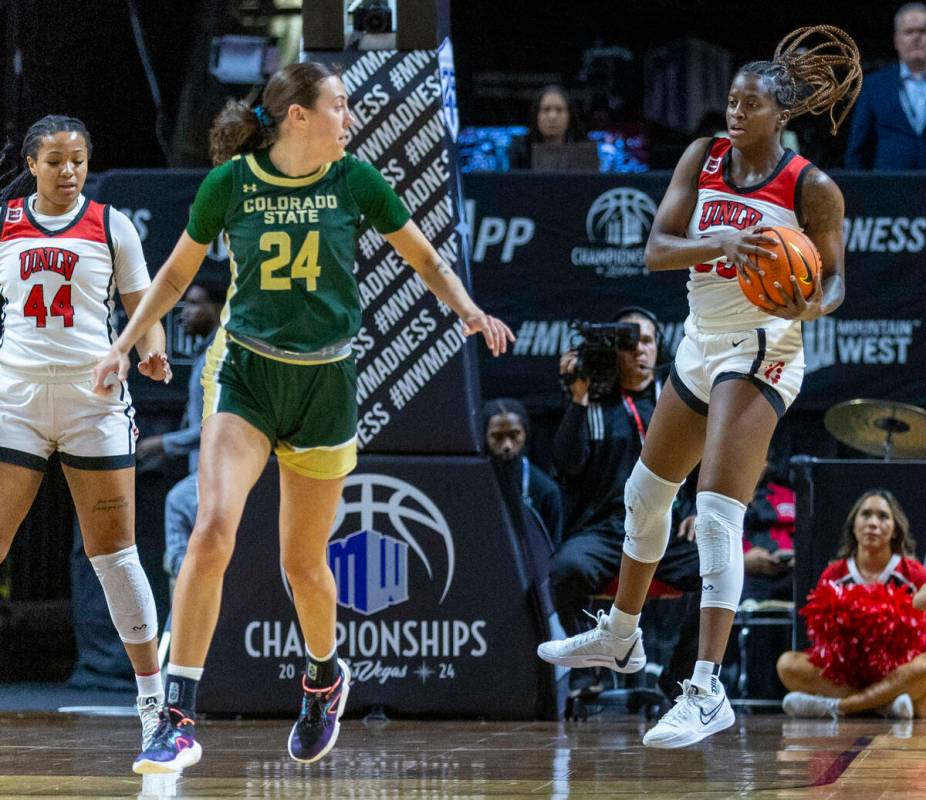 UNLV Lady Rebels center Desi-Rae Young (23) comes down with a rebound over Colorado State Rams ...