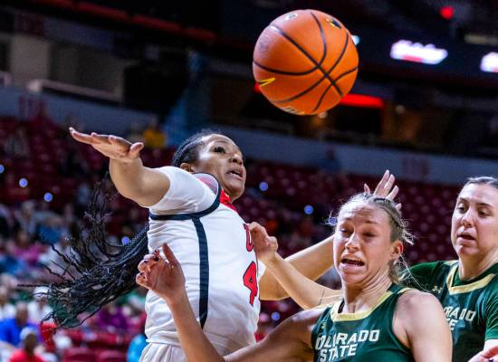 UNLV Lady Rebels forward Alyssa Brown (44) slaps away a loose ball from Colorado State Rams gua ...