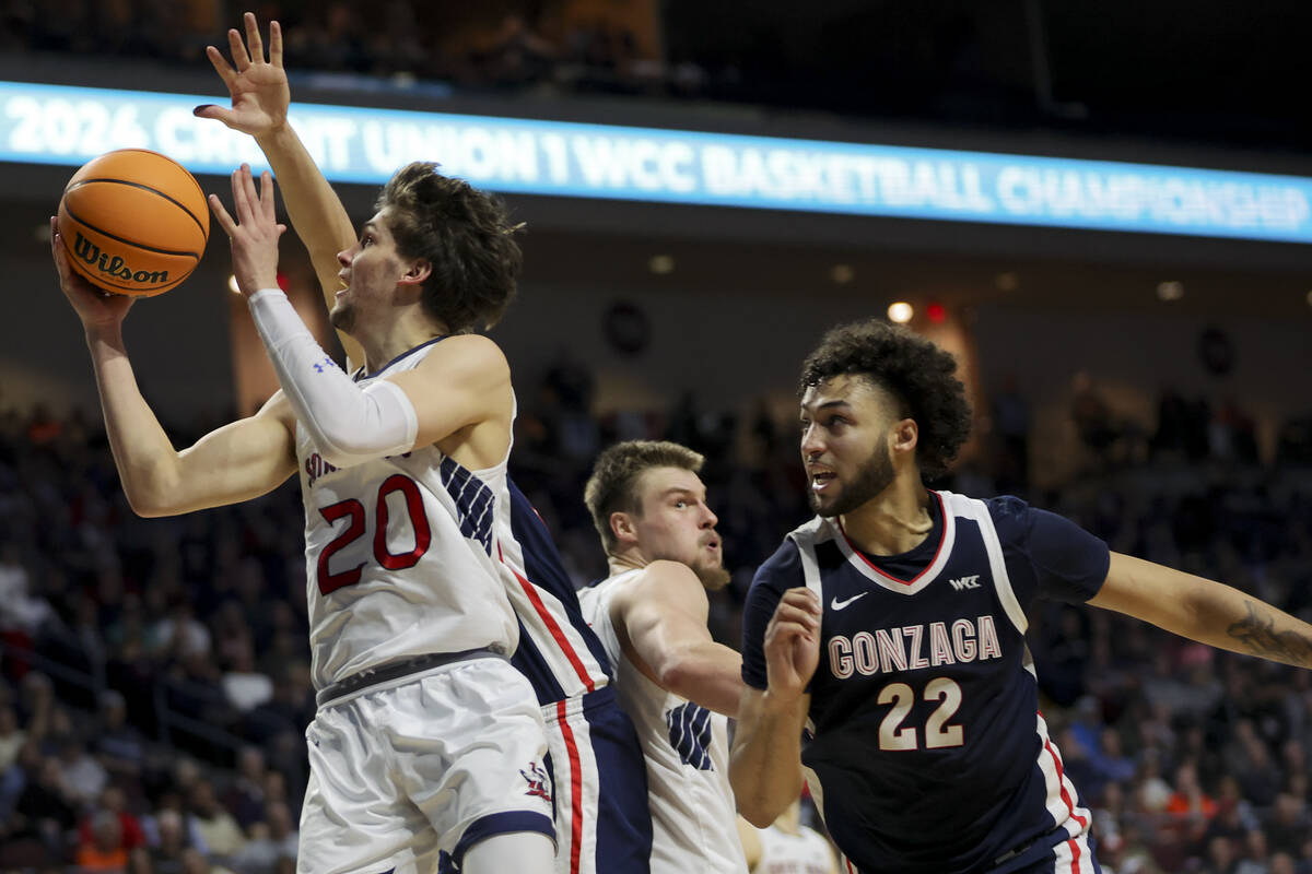 St. Mary's Gaels guard Aidan Mahaney (20) shoots while Gonzaga Bulldogs forward Anton Watson (2 ...