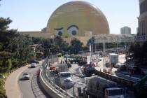 Emoji looks on as crews remove fencing from the Las Vegas Grand Prix course on Sands Avenue in ...