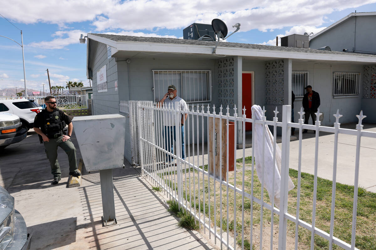 A security officer guards an apartment complex in the 2200 block of East Nelson Avenue in North ...