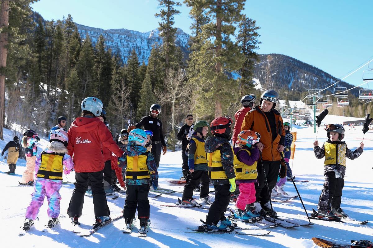 Young ski and snowboard students line up for their last run of the morning at Lee Canyon ski re ...