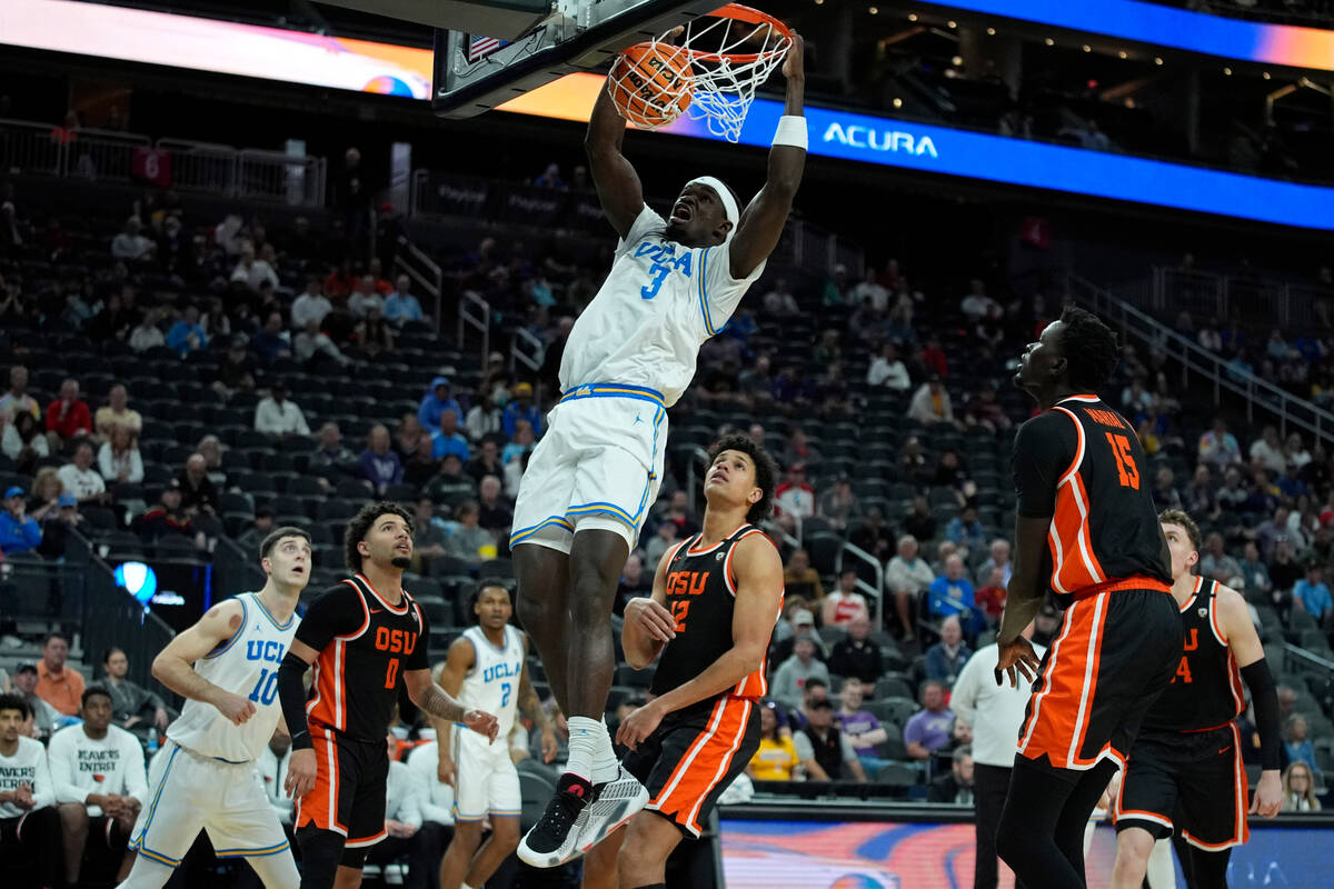 UCLA forward Adem Bona (3) dunks against Oregon State during the first half of an NCAA college ...