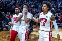 UNLV Rebels guard Dedan Thomas Jr. (11) is dejected while being escorted off the court by teamm ...