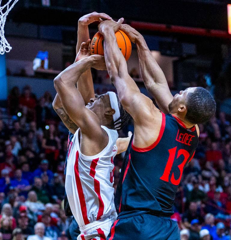 UNLV Rebels guard Shane Nowell (3) has the ball ripped away from behind by San Diego State Azte ...