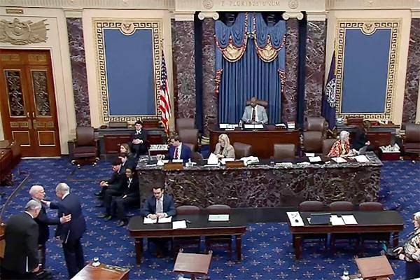 In this image from video provided by Senate TV, Senate Majority Leader Chuck Schumer, D-N.Y., t ...