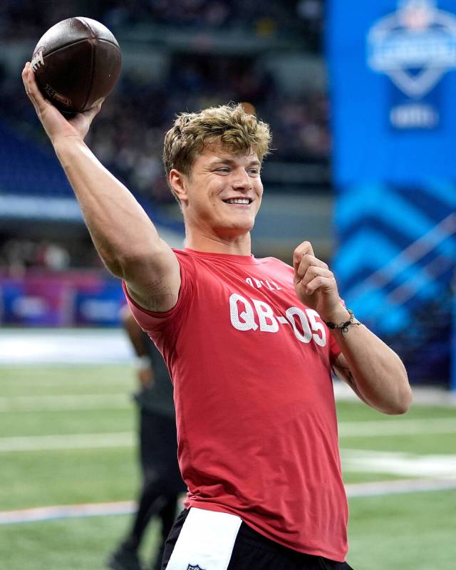 Michigan quarterback J.J. McCarthy passes during the NFL football scouting combine, Saturday, M ...