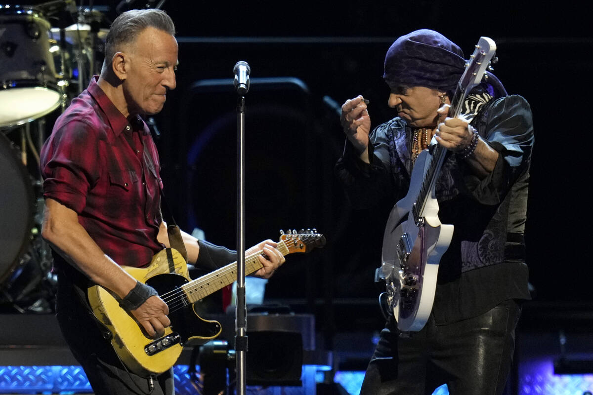 Bruce Springsteen, left, and Stevie Van Zandt, right, play their guitars on stage during his co ...