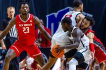 New Mexico Lobos guard Jaelen House (10) gets caught in a pick as San Diego State Aztecs guard ...