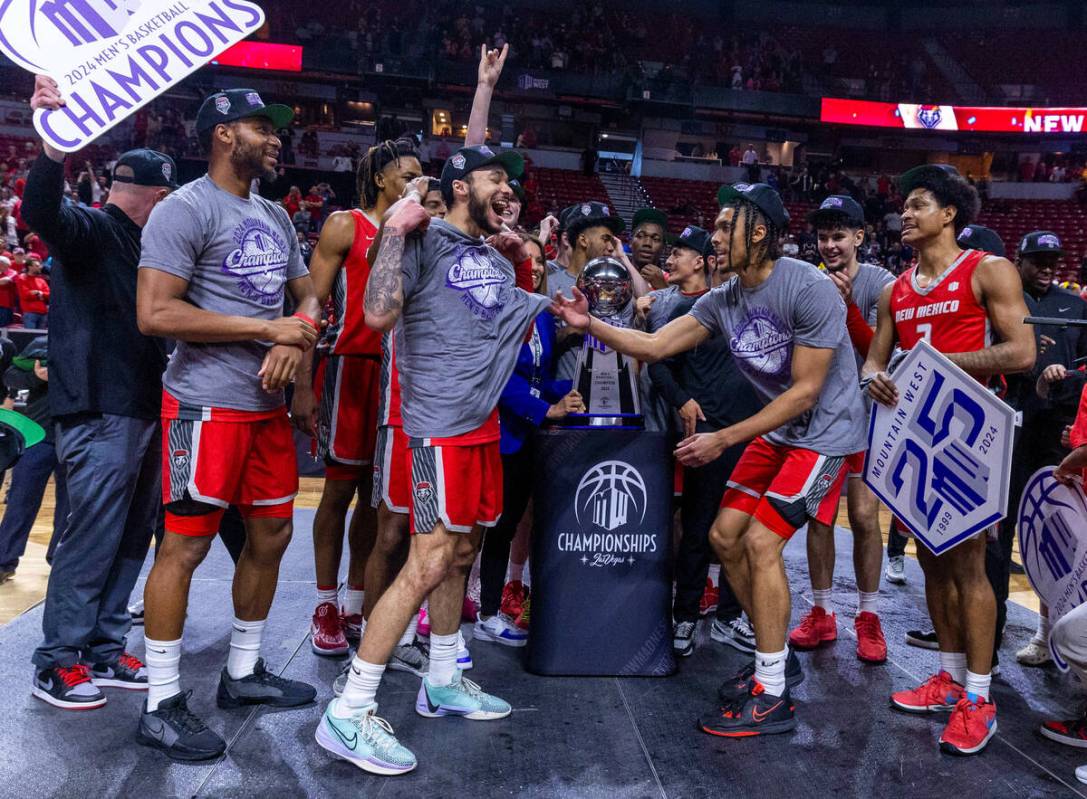 The New Mexico Lobos celebrate their win over the San Diego State Aztecs following their Mounta ...