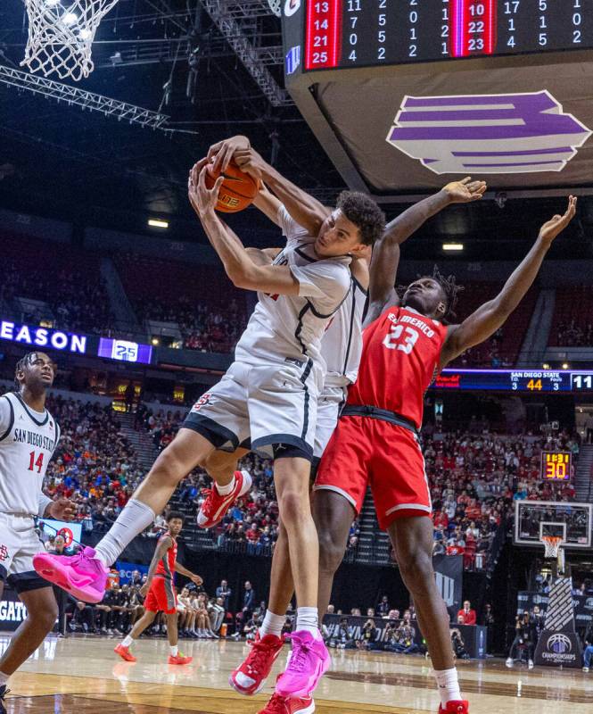 San Diego State Aztecs guard Miles Byrd (21) pulls down a rebound against New Mexico Lobos cent ...