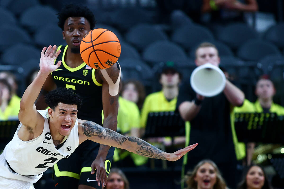 Colorado Buffaloes guard KJ Simpson (2) loses control of the ball while Oregon Ducks guard Jerm ...