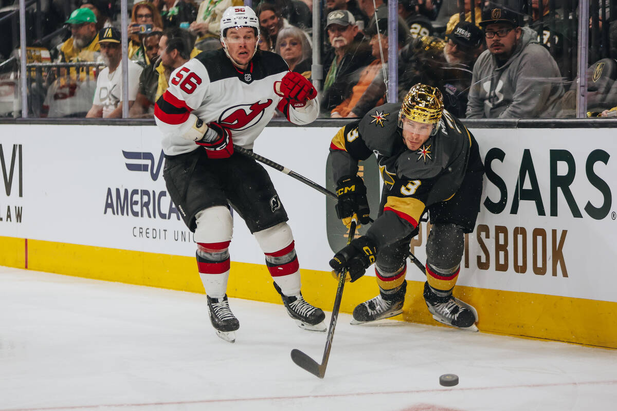 Golden Knights defenseman Brayden McNabb (3) and New Jersey Devils defenseman Kurtis MacDermid ...