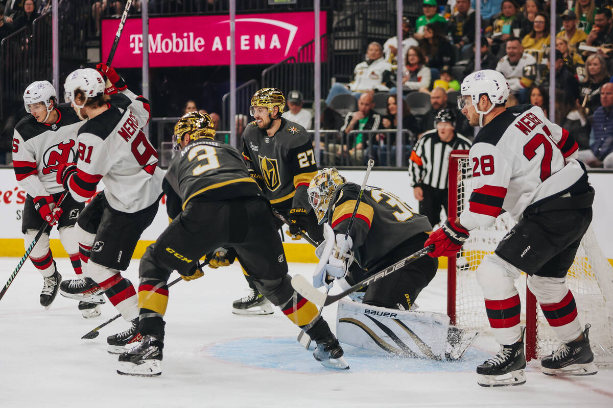 Golden Knights goaltender Logan Thompson (36) eyes the puck as it nears the net during an NHL g ...