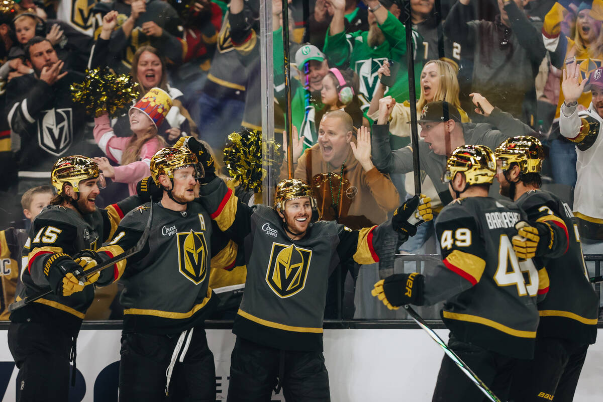 Golden Knights players celebrate a goal made by Golden Knights center Jack Eichel (9) during an ...