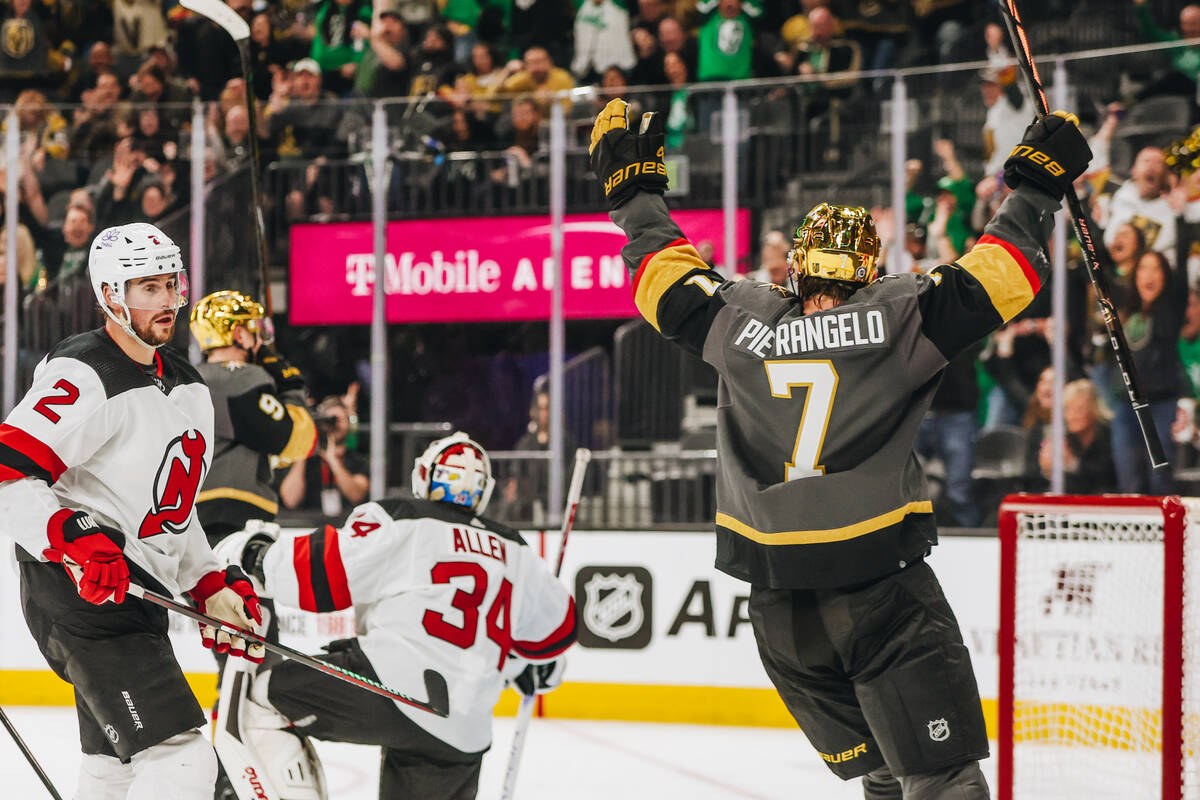 Golden Knights defenseman Alex Pietrangelo (7) celebrates a goal made by Golden Knights center ...