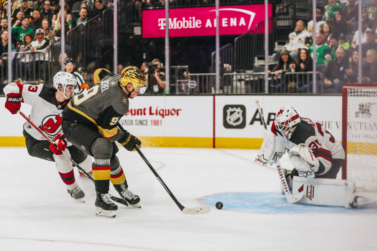 Golden Knights center Jack Eichel (9) shoots the puck to the net during an NHL game between the ...