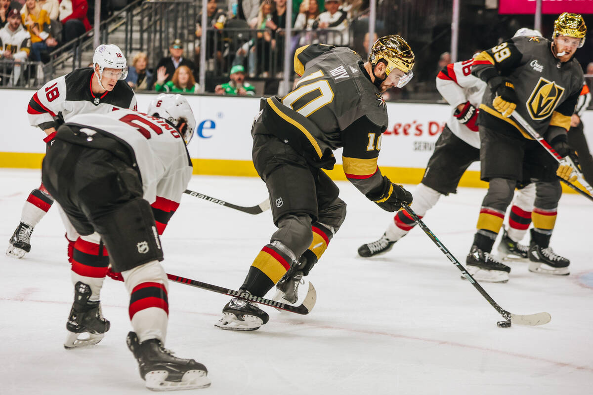 Golden Knights center Nicolas Roy (10) shuffles the puck across the ice during an NHL game betw ...