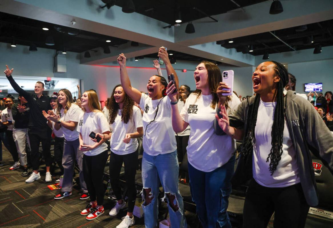 Members of the UNLV Lady Rebels basketball team cheer after their placement was announced in th ...