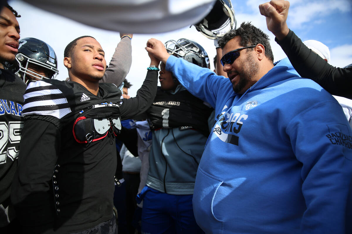 Desert Pines' head coach Tico Rodriguez, right, leads a chant at the end of a team practice at ...