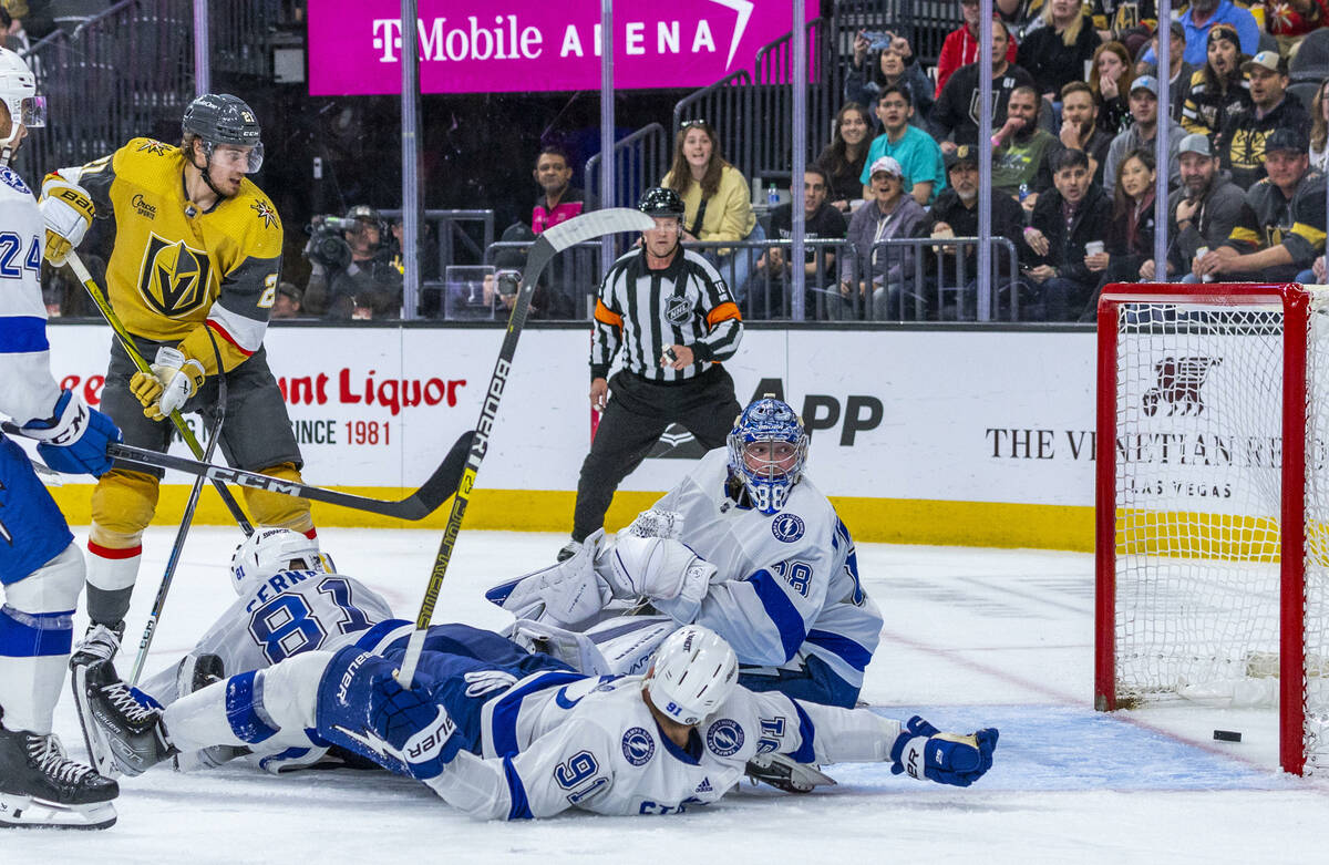 Golden Knights center Brett Howden (21) looks to a score as it gets past Tampa Bay Lightning go ...