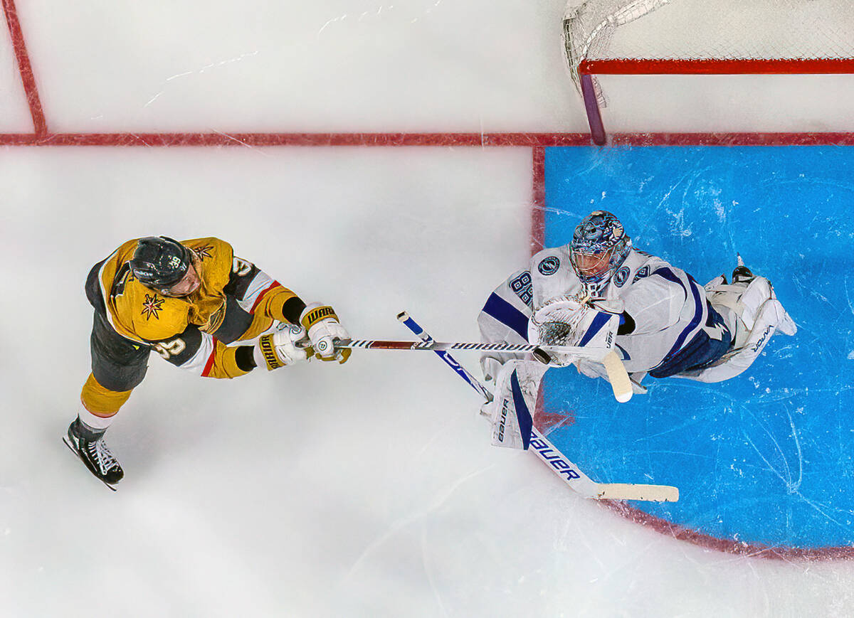 Golden Knights right wing Anthony Mantha (39) attempts to deflect a puck past Tampa Bay Lightni ...