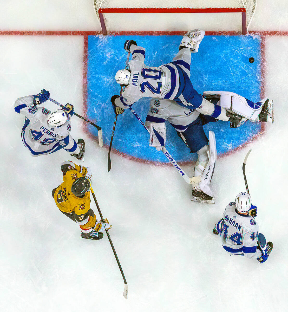 Tampa Bay Lightning left wing Nicholas Paul (20) crashes over goaltender Andrei Vasilevskiy (88 ...