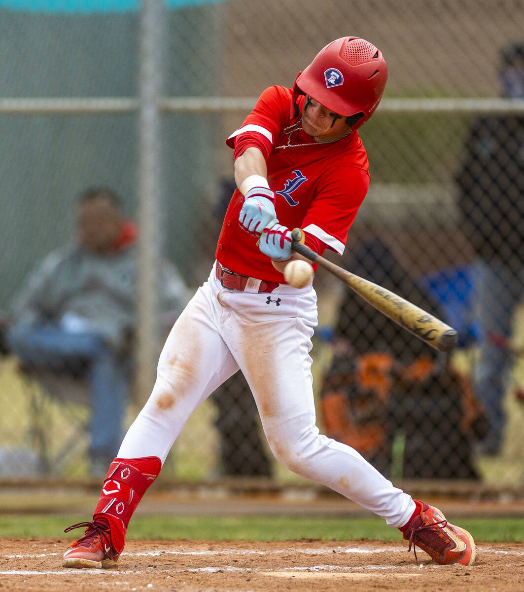 Liberty batter Nicholas Blakeney connects on a pitch versus Spring Valley during the fifth inni ...