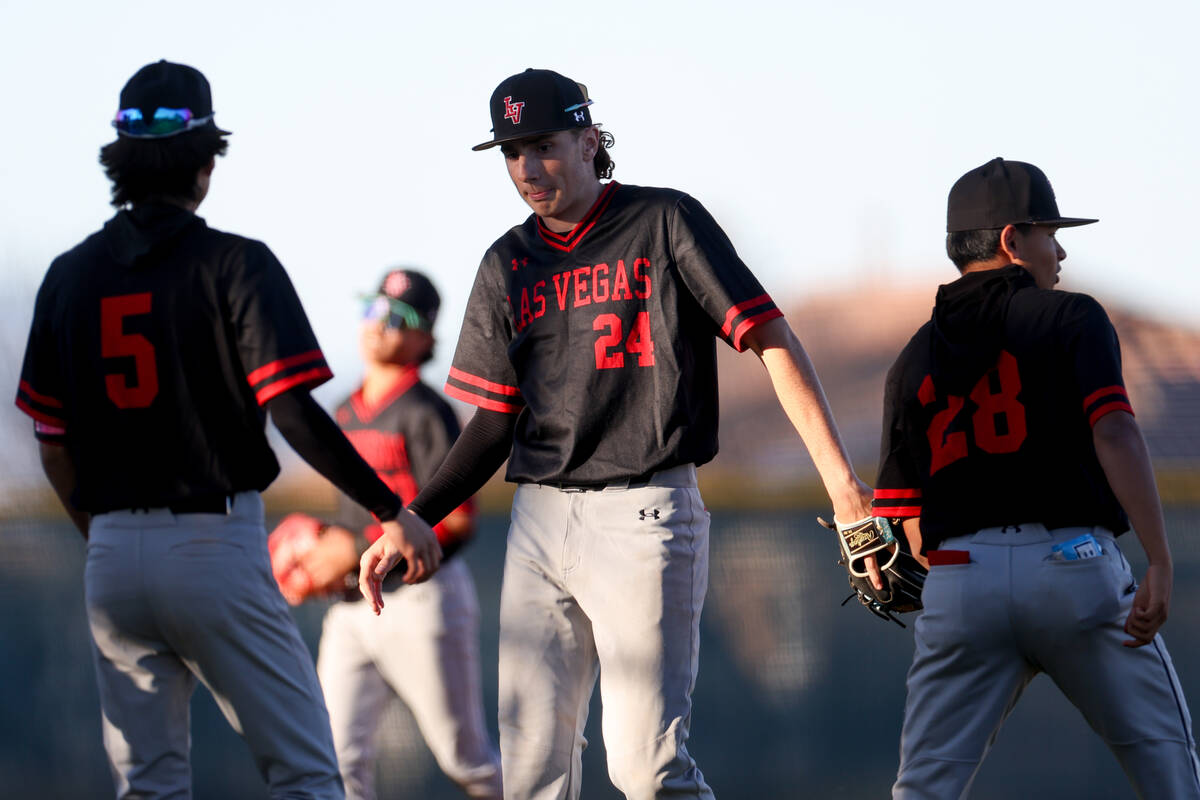 Las Vegas’ Joseph Ponticello (24) high fives Trevor Mangano (5) after they won a high sc ...