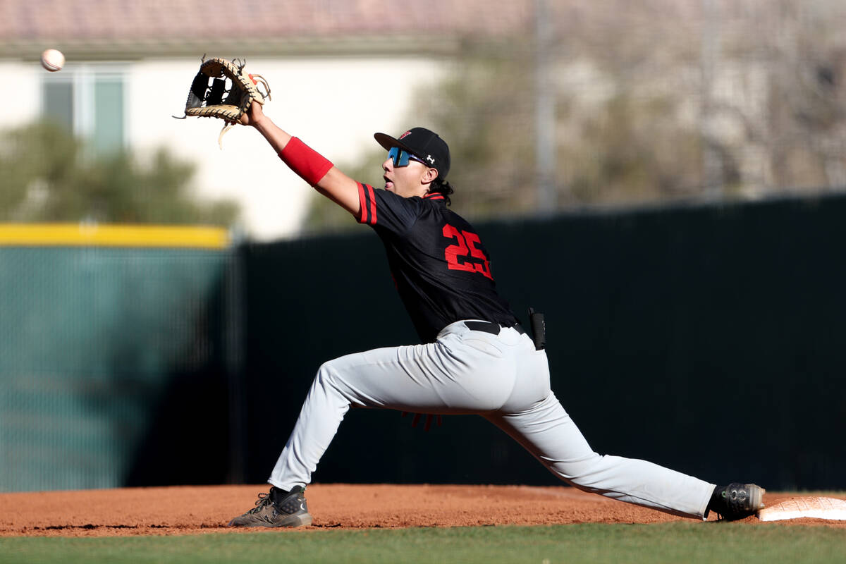 Las Vegas first baseman Dallas Martinez (25) lunges to catch for an out on Desert Oasis during ...