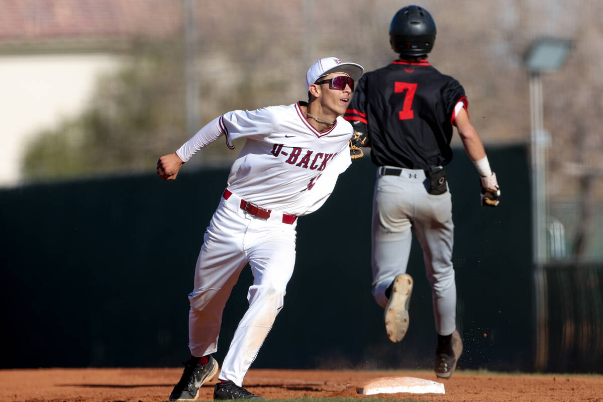 Desert Oasis first baseman Aaron Del Valle, left, attempts to tag Las Vegas’ Mickey Mart ...