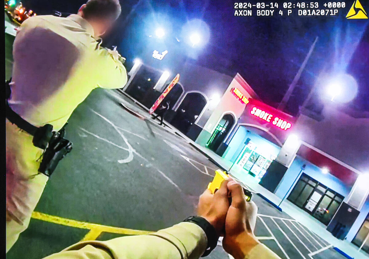 A photo of a body camera footage of Metro officers approaching suspect Ismael Barney Castillo, ...