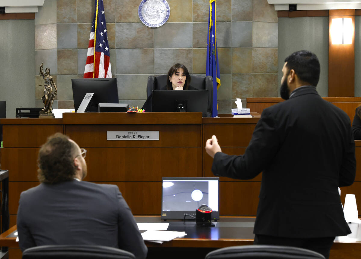 Judge Danielle “Pieper” Chio, center, listens as Athar Haseebullah, right, execut ...
