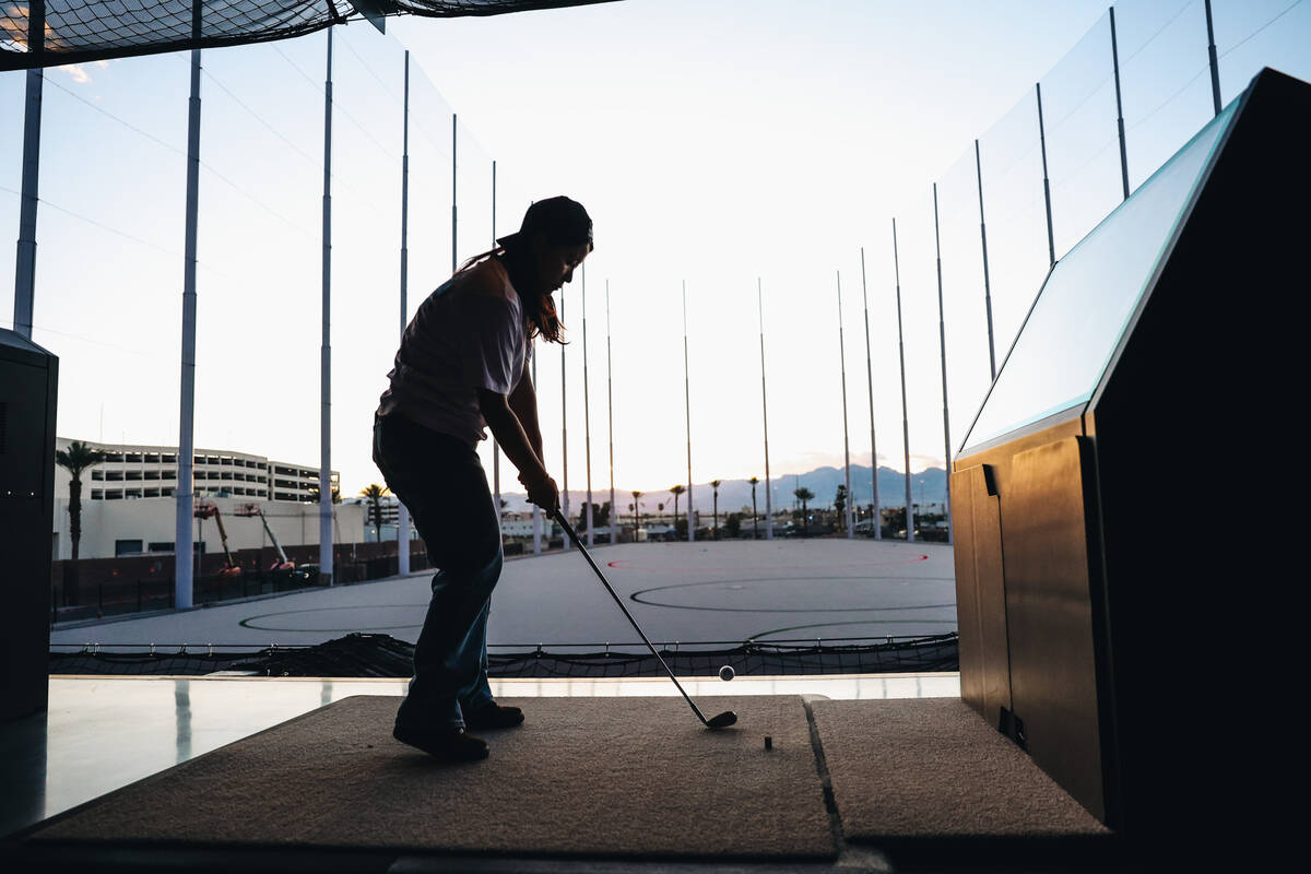 Golfers try out the bays at Atomic Golf on Wednesday, March 20, 2024, in Las Vegas. (Madeline C ...