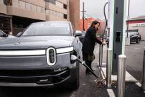 Angie Manetti charges her Rivian on Jan. 9, 2024, at an Electrify America station in downtown S ...
