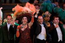 Folies Bergere cast members toast the audience (consisting mostly of alumni) inside the Tiffany ...