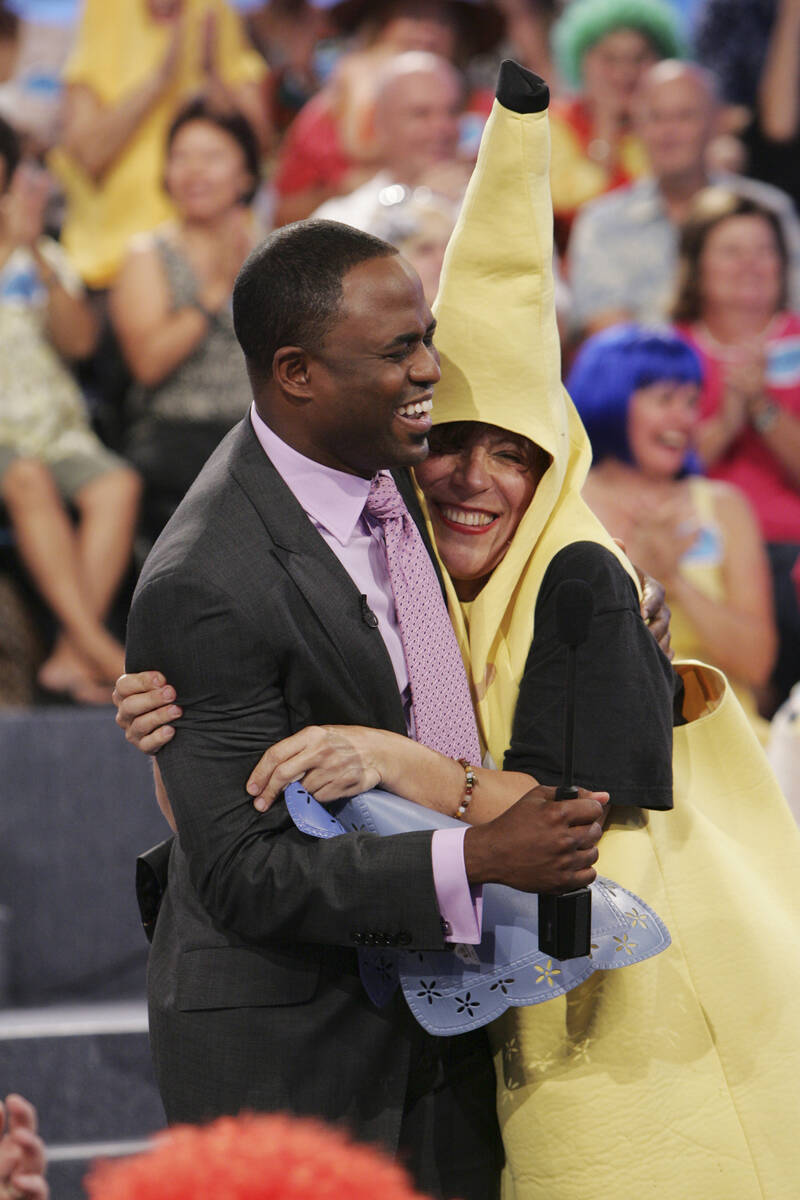 Host Wayne Brady hugs an audience member during a taping of "Let's Make a Deal" on Sept. 15, 20 ...