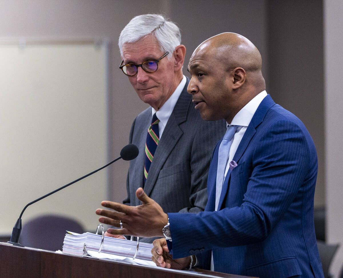 Bally's Corporation Treasurer/Director Marcus Glover, right, with lawyer Dan Reaser speaks at t ...