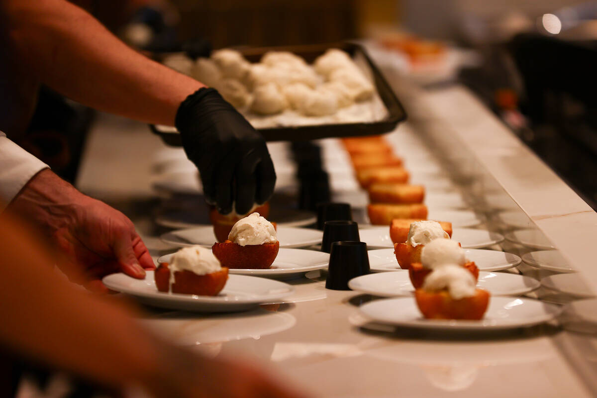Desserts are prepared to be circulated during an opening night party at Emmitt's Vegas in Fashi ...