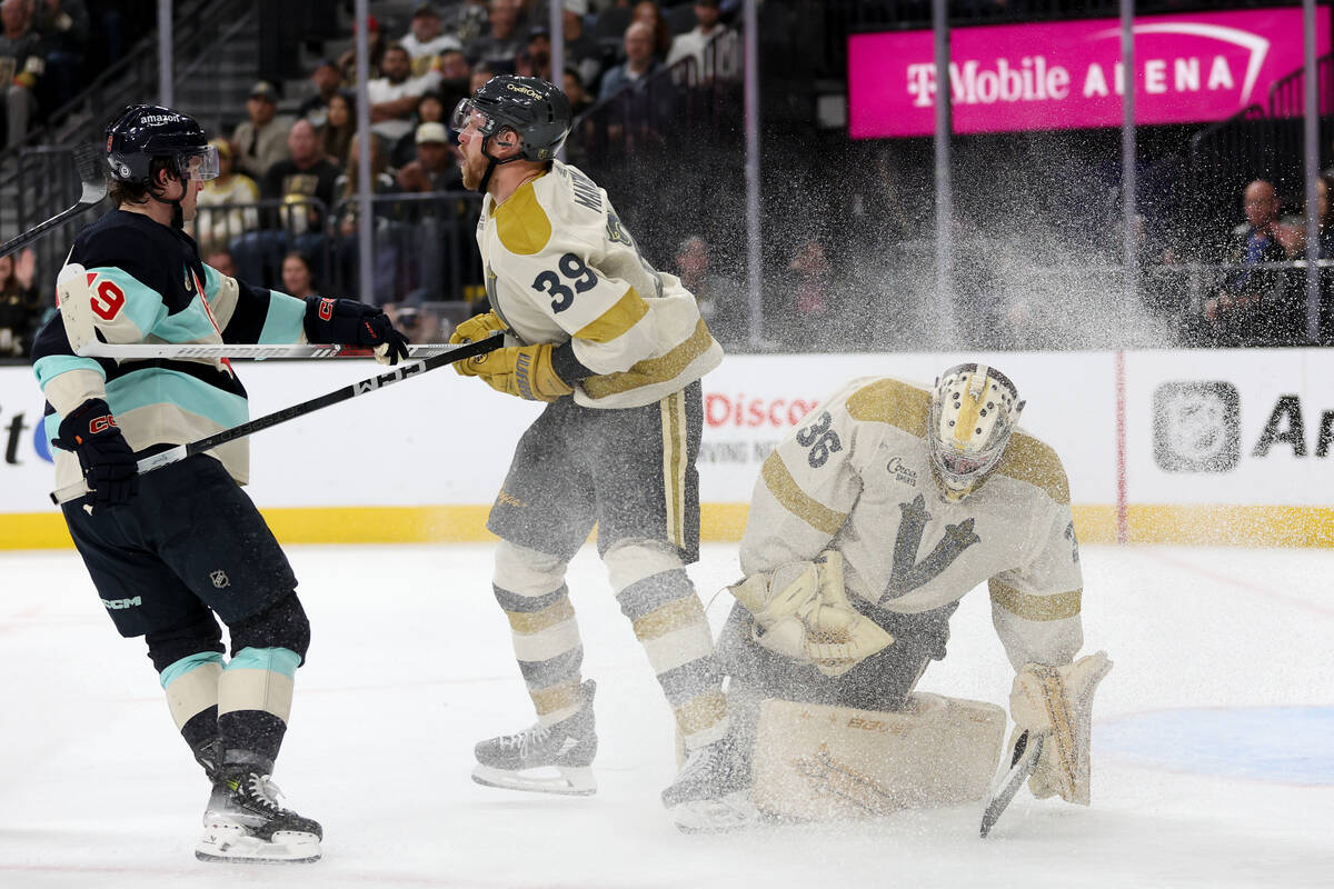 Golden Knights right wing Anthony Mantha (39) takes a stick to the stomach from Kraken left win ...