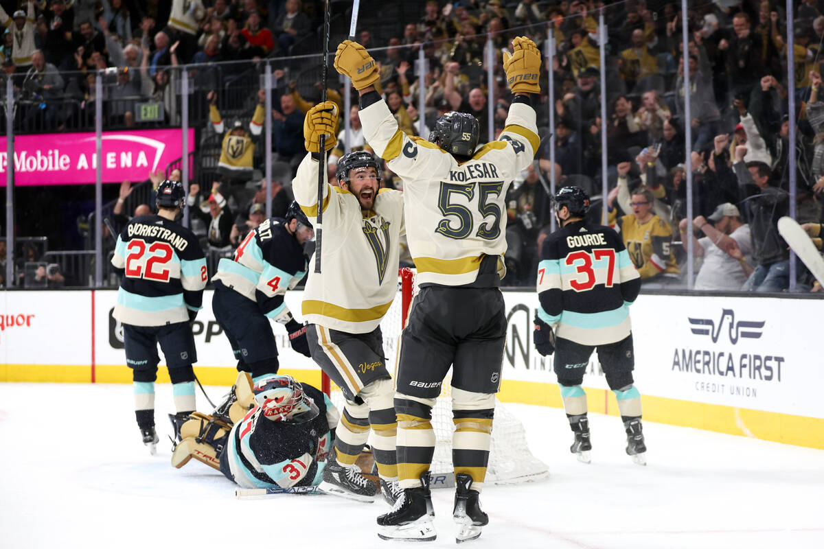 Golden Knights center Nicolas Roy (10) and right wing Keegan Kolesar (55) celebrate Kolesar&#x2 ...