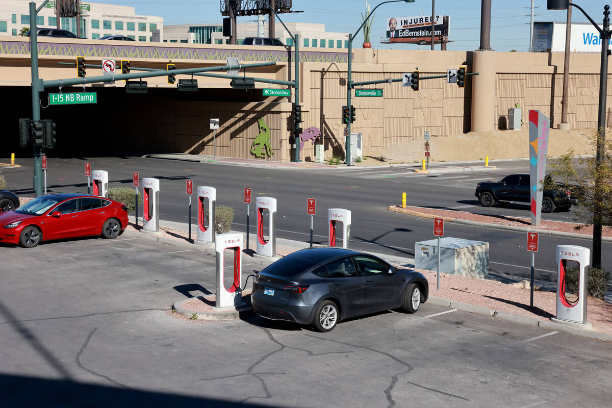 Electric vehicles charge at the Las Vegas North Premium Outlets on Thursday, March 21, 2024. (K ...