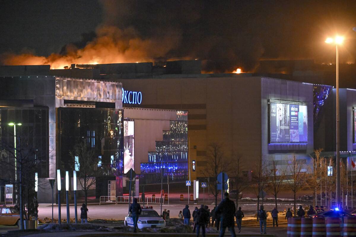 A massive blaze is seen over the Crocus City Hall on the western edge of Moscow, Russia, Friday ...