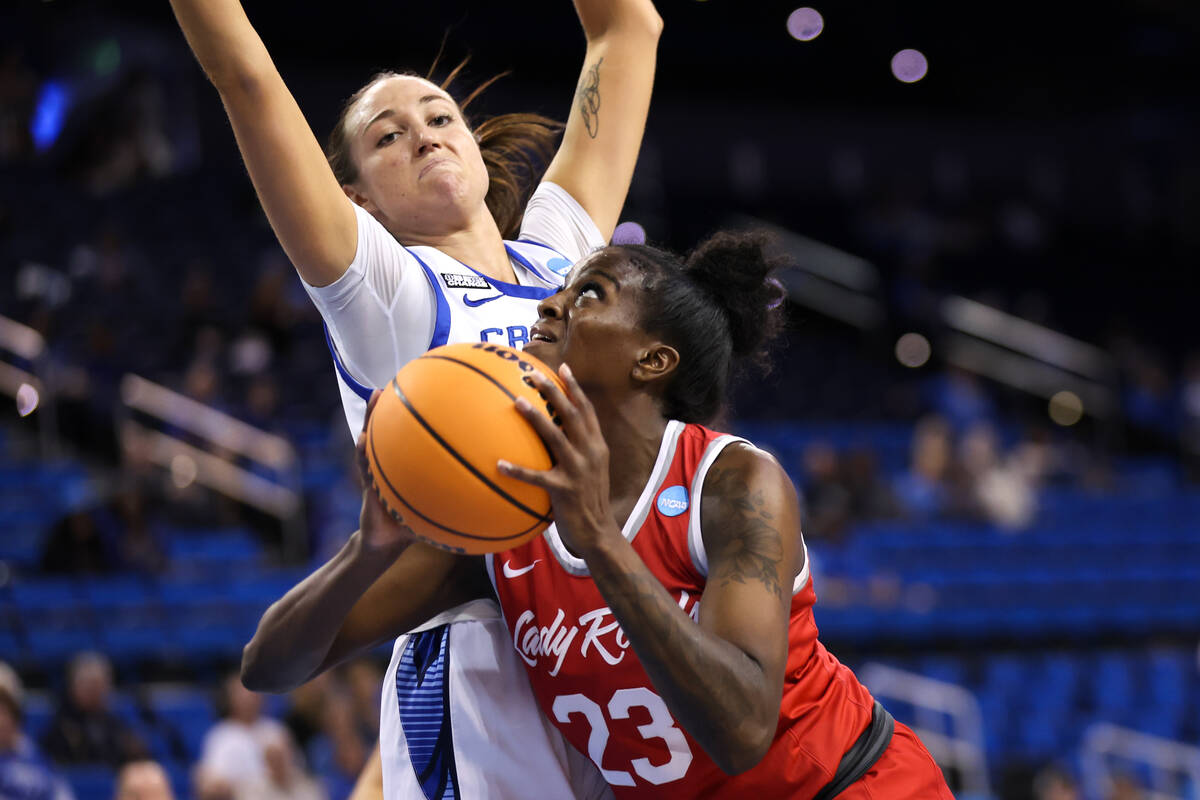 UNLV Lady Rebels center Desi-Rae Young (23) shoots against Creighton Bluejays forward Emma Rons ...