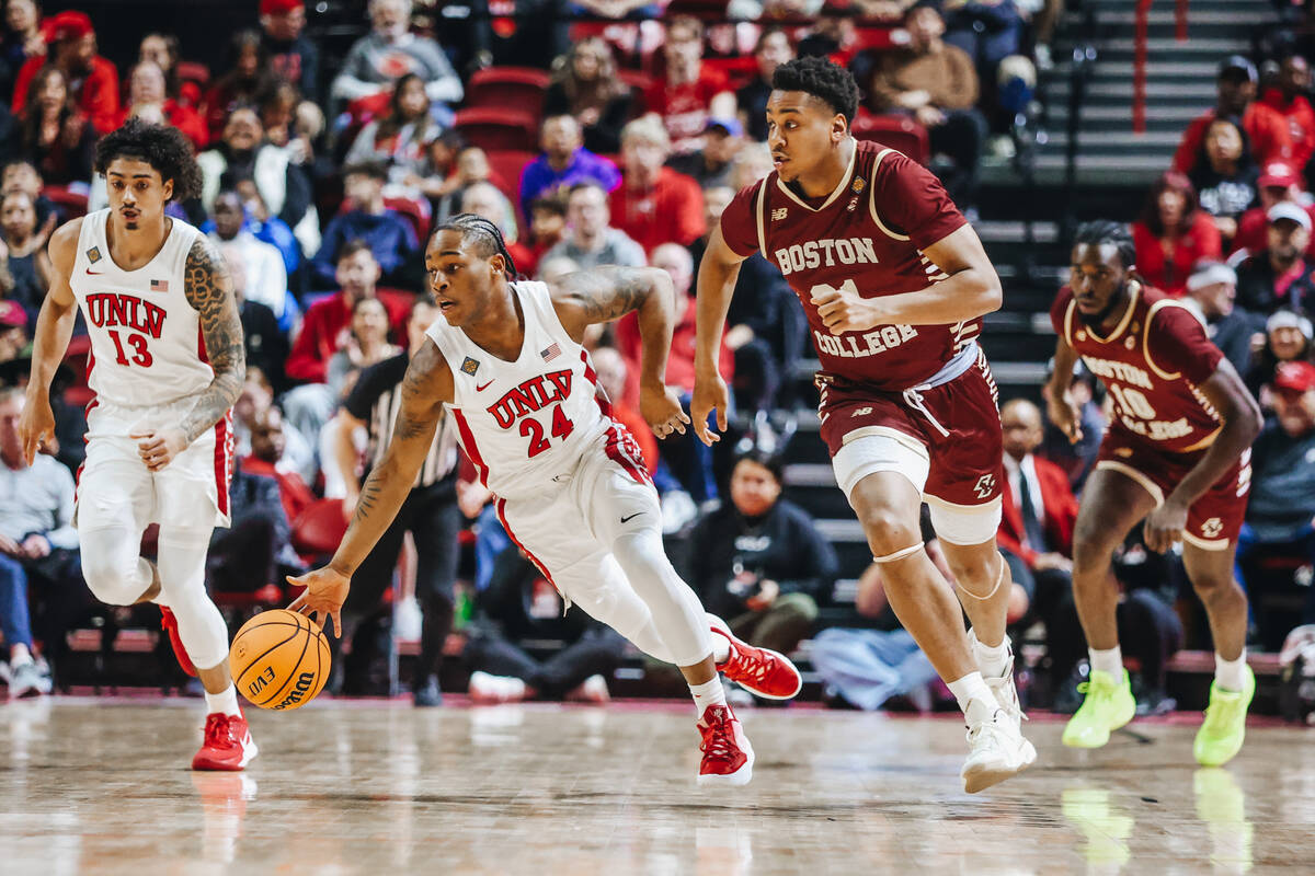 UNLV guard Jackie Johnson III (24) drives the ball down the court after making a steal during a ...