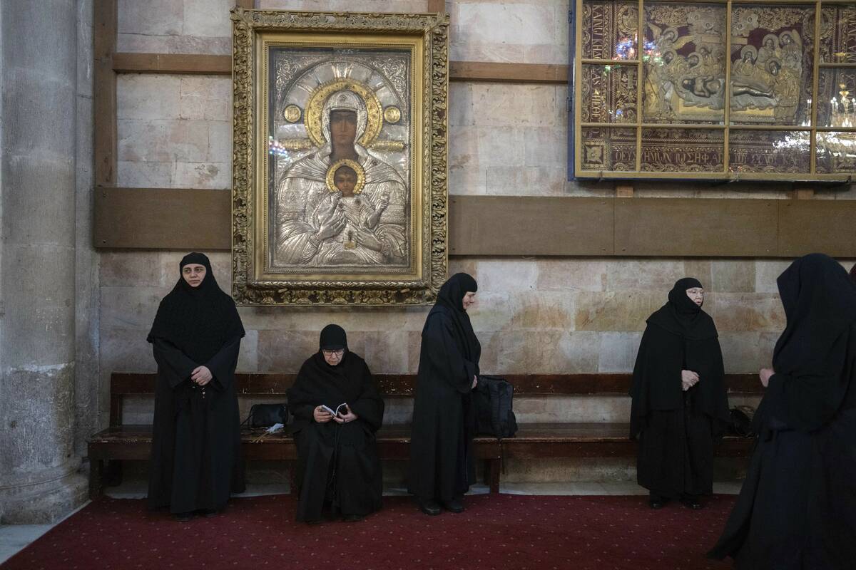 Christian Orthodox pilgrims attend the Palm Sunday procession at the Church of the Holy Sepulch ...