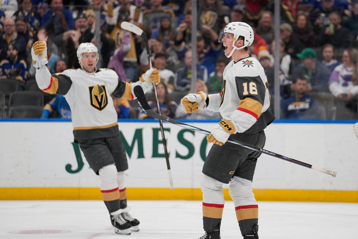 Vegas Golden Knights' Pavel Dorofeyev (16) celebrates after scoring as teammate Ben Hutton watc ...